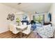 Modern dining area with white table and chairs at 7607 Grand Estuary Trl # 205, Bradenton, FL 34212