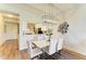 Modern dining room with white table and chairs at 7607 Grand Estuary Trl # 205, Bradenton, FL 34212