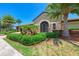 Elegant community building with stone exterior and lush landscaping at 7607 Grand Estuary Trl # 205, Bradenton, FL 34212