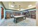 Clubhouse game room with pool table and extensive library at 7607 Grand Estuary Trl # 205, Bradenton, FL 34212