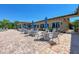 Relaxing poolside patio area with tables and chairs for dining at 7607 Grand Estuary Trl # 205, Bradenton, FL 34212