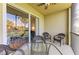 Screened balcony with view and seating at 7607 Grand Estuary Trl # 205, Bradenton, FL 34212