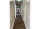 Long hallway with wood-look flooring at 3375 8Th St, Sarasota, FL 34237