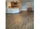 Kitchen with white cabinets, granite countertops, and wood-look floors at 3375 8Th St, Sarasota, FL 34237