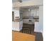 White kitchen with granite countertops and tile floor at 3375 8Th St, Sarasota, FL 34237