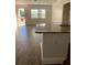 Kitchen with granite countertop island and wood-look floors at 3375 8Th St, Sarasota, FL 34237