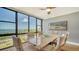 Bright dining room with water views and modern table at 770 S Palm Ave # 603, Sarasota, FL 34236