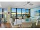 Elegant dining area with water views and hardwood floors at 770 S Palm Ave # 603, Sarasota, FL 34236