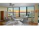 Living room features sunset views and hardwood floors at 770 S Palm Ave # 603, Sarasota, FL 34236