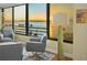 Living area showcases sunset views and comfy seating at 770 S Palm Ave # 603, Sarasota, FL 34236