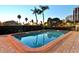 Inviting community pool with palm trees at 770 S Palm Ave # 603, Sarasota, FL 34236