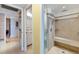 Large walk-in shower with built-in bench seating at 1750 Benjamin Franklin Dr # 2G, Sarasota, FL 34236