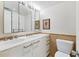 Modern bathroom with double vanity and marble countertops at 1750 Benjamin Franklin Dr # 2G, Sarasota, FL 34236