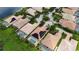 Aerial view of community, showcasing homes with solar panels and pools at 5901 Mariposa Ln, Sarasota, FL 34238
