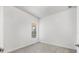 Simple bedroom with large window and neutral decor at 5901 Mariposa Ln, Sarasota, FL 34238