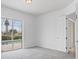 Bright bedroom with pool view and ample natural light at 5901 Mariposa Ln, Sarasota, FL 34238
