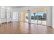 Spacious dining area with pool view and sliding glass doors at 5901 Mariposa Ln, Sarasota, FL 34238