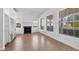 Living room with fireplace and large windows at 5901 Mariposa Ln, Sarasota, FL 34238