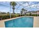 Inviting screened pool with a view of the community at 5901 Mariposa Ln, Sarasota, FL 34238