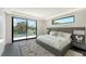 Bright bedroom with king-size bed and private balcony access at 1610 N Lodge Dr, Sarasota, FL 34239