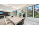 Bright dining area featuring a marble table, modern chairs, and large windows at 1610 N Lodge Dr, Sarasota, FL 34239