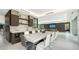 Modern dining room with large marble table and contemporary chairs at 1610 N Lodge Dr, Sarasota, FL 34239