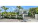 Modern home exterior with a gated entry and manicured landscaping at 1610 N Lodge Dr, Sarasota, FL 34239