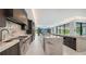 Modern kitchen with marble countertops and stainless steel appliances at 1610 N Lodge Dr, Sarasota, FL 34239