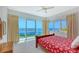 Cozy bedroom with water views, neutral walls, and comfortable furnishings at 5444 Gulf Of Mexico Dr, Longboat Key, FL 34228