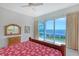 Cozy bedroom with water views, neutral walls, and comfortable furnishings at 5444 Gulf Of Mexico Dr, Longboat Key, FL 34228