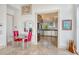 Modern kitchen open to the dining area, featuring stainless steel appliances and stone countertops at 5444 Gulf Of Mexico Dr, Longboat Key, FL 34228