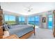 Serene main bedroom with water views, access to the balcony, and light-colored carpet at 5444 Gulf Of Mexico Dr, Longboat Key, FL 34228