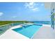 Gorgeous rooftop pool and patio area offering panoramic water views at 5444 Gulf Of Mexico Dr, Longboat Key, FL 34228