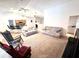 Open living room and kitchen area with vaulted ceiling and neutral decor at 623 147Th E St, Bradenton, FL 34212