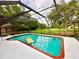 Inviting screened pool with brick coping and patio area at 623 147Th E St, Bradenton, FL 34212