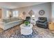 Spacious living room boasts ample seating and large windows, creating an inviting atmosphere at 8930 Tuscany Isles Dr, Punta Gorda, FL 33950