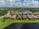 An aerial view of a home situated near a lake within a community at 7112 Marsh View Ter, Bradenton, FL 34212