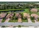 An aerial view of a home with a tile roof and lush landscaping at 7112 Marsh View Ter, Bradenton, FL 34212