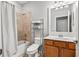 Clean bathroom with a shower/tub combo and wood vanity at 7112 Marsh View Ter, Bradenton, FL 34212