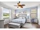 Bedroom with a queen bed and calming decor at 7112 Marsh View Ter, Bradenton, FL 34212