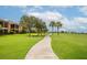 A paved pathway winds through a lush green golf course community at 7112 Marsh View Ter, Bradenton, FL 34212