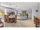 Open concept dining room with wood table and chairs at 7112 Marsh View Ter, Bradenton, FL 34212