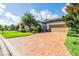 Single story home with tan colored garage door at 7112 Marsh View Ter, Bradenton, FL 34212