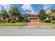 Single story home with tan colored garage door at 7112 Marsh View Ter, Bradenton, FL 34212