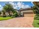 Single story home with tan colored garage door at 7112 Marsh View Ter, Bradenton, FL 34212