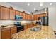 Granite countertops and stainless steel appliances in this kitchen at 7112 Marsh View Ter, Bradenton, FL 34212