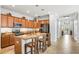 Modern kitchen with granite countertops, stainless steel appliances, and an island at 7112 Marsh View Ter, Bradenton, FL 34212