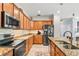 Modern kitchen with stainless steel appliances and granite counters at 7112 Marsh View Ter, Bradenton, FL 34212