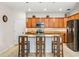 Island kitchen with granite countertops and wood cabinetry at 7112 Marsh View Ter, Bradenton, FL 34212
