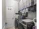 Laundry room with washer, dryer, and overhead storage at 7112 Marsh View Ter, Bradenton, FL 34212